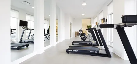Fitness room with treadmills and mirrors