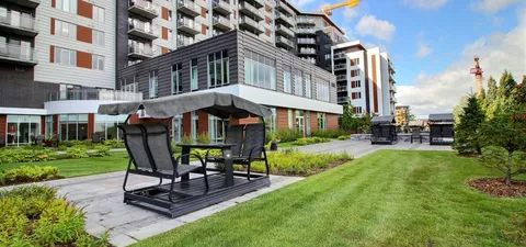 Garden lawn with a swing seat beside the residence