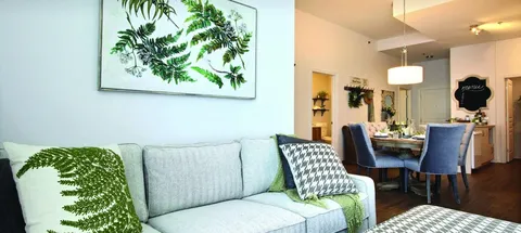 Suite living area with a sofa and adjoining dining table