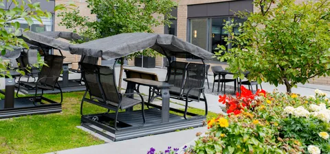 Garden with flowers and covered outdoor swings