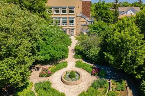 Aerial view of a landscaped courtyard with a circular planter and paved paths