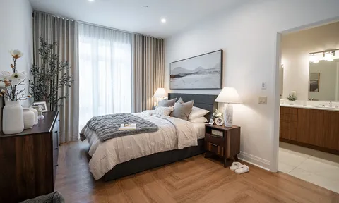 Bedroom with double bed and wood flooring