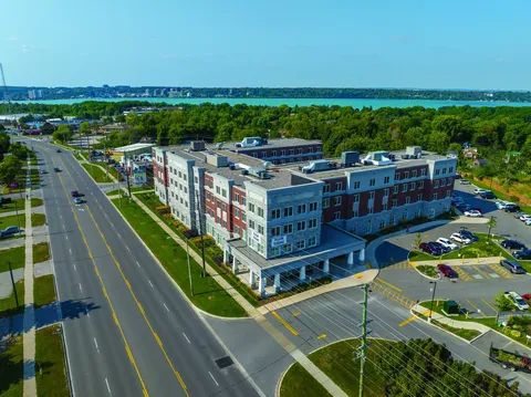 Aerial view of the residence building, entrance and parking area
