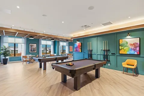 Games area with pool tables and lounge seating