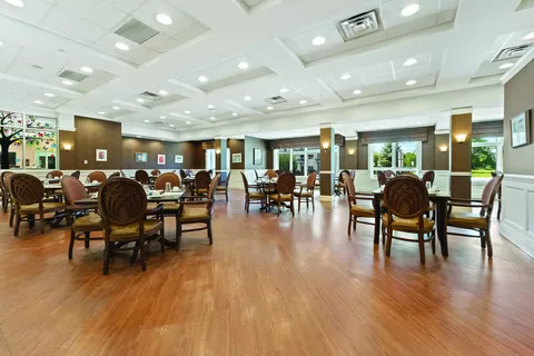 Dining room with round tables and upholstered chairs