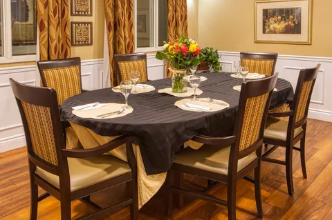 Private dining room with a long table and floral centrepiece