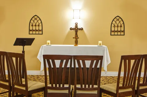 Chapel with an altar, lectern and rows of chairs