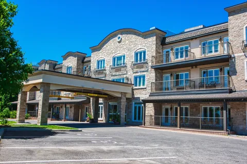 Residence exterior with balconies and a covered entrance