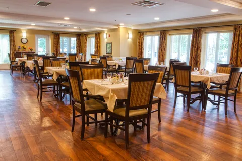 Dining room with set tables beside large windows