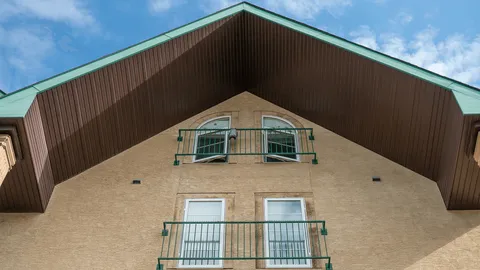 Residence roofline and upper balconies.