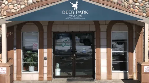 Main entrance beneath the Deer Park Village sign.