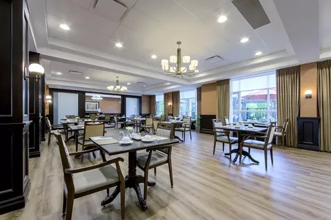 Dining room with set tables, chairs and windows