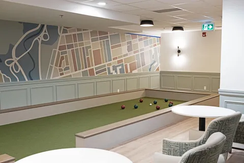 Indoor games area with bocce balls and tables
