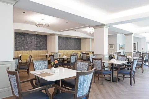 Dining room with set tables and booth seating
