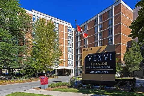 Residence exterior with balconies and landscaped grounds