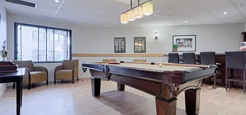 Games room with a pool table and lounge seating