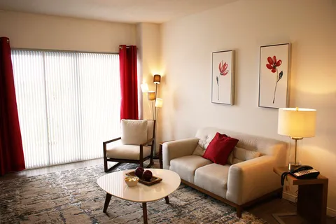 Suite sitting area with a sofa, armchair and coffee table.