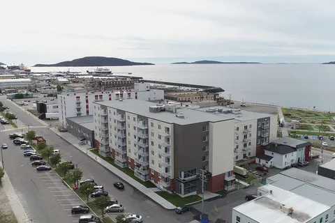 Aerial view of the residence buildings beside the waterfront.