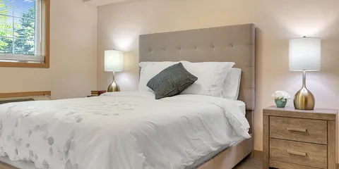 Bedroom with a double bed, bedside tables and lamps