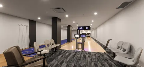 Bowling lanes with upholstered seating and overhead lights
