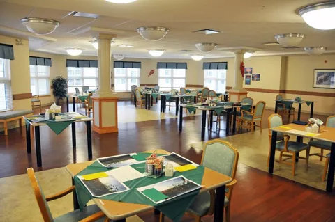Dining room with tables, chairs and large windows