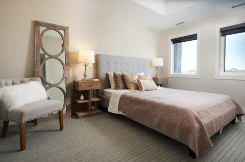 Bedroom with a double bed, bedside tables and a chair