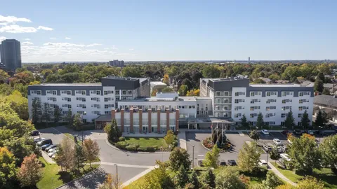 Aerial view of the residence complex and tree-lined grounds