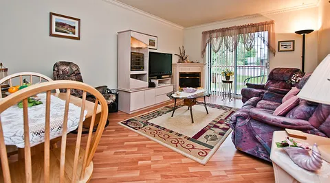 Suite living area with sofas and a dining table.