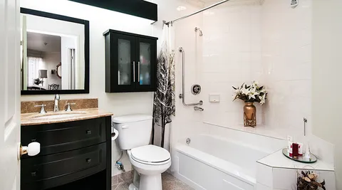 Bathroom with a shower, sink and toilet.