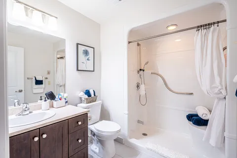 Bathroom with a shower, toilet and sink