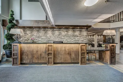 Reception desk with a stone feature wall.