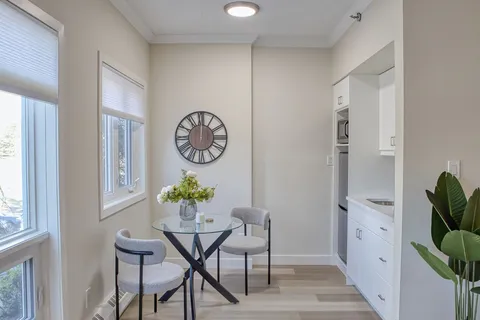 Suite kitchenette with a small dining table.