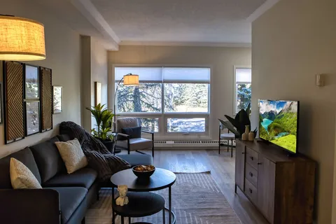 Suite living room with a sofa and television.