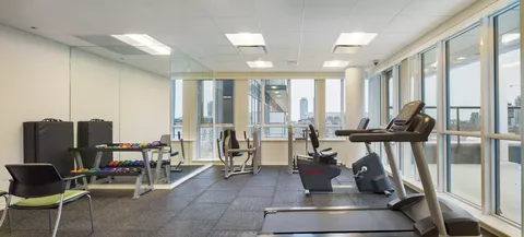 Fitness room with treadmills, exercise bicycles and large windows