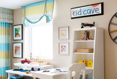 Small table and chairs with toys and animal pictures