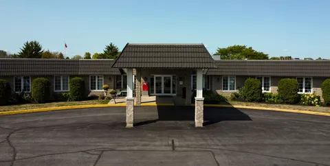 Single-storey residence with a covered entrance and landscaped frontage.