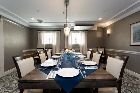 Private dining room with a long set table.