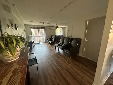 Waiting area with chairs beside the entrance.