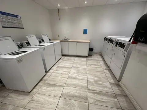 Laundry room with washers and dryers.