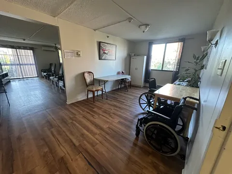 Dining room with tables near large windows.