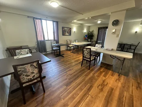 Dining area with small tables and chairs.