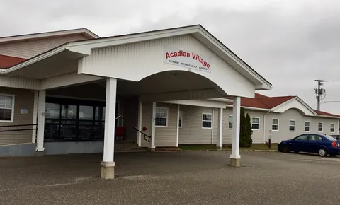 Residence frontage with a covered entrance, white siding and a red roof.