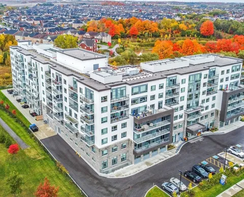Aerial view of the multi-storey residence and surrounding streets.