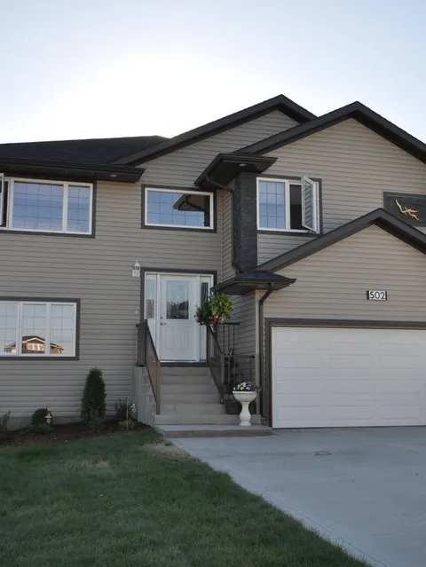 Two-storey residence with a front staircase, garage and house number 502.