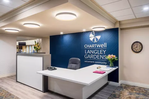 Reception desk with a blue wall and residence sign
