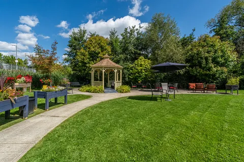 Garden with raised planting beds, a gazebo and outdoor seating
