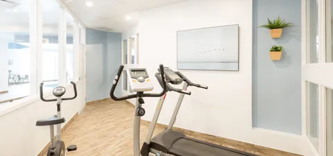 Exercise area with a stationary bicycle and a treadmill