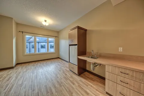 Suite living area with a kitchenette.