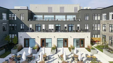 Landscaped courtyard with seating and paved paths.
