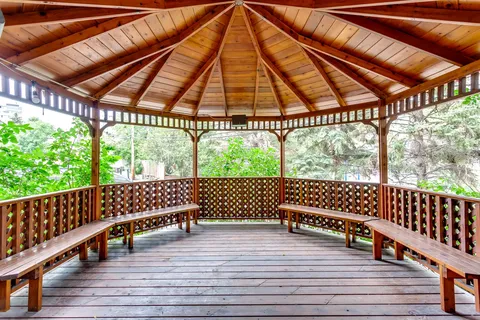 Wooden gazebo with built-in benches